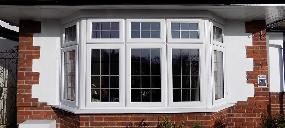 Photo displaying a white UPVC double glazed window. This bay window not only helps with reducing noise but it is also better for heat insulation making it an ideal double glazing unit for homes.